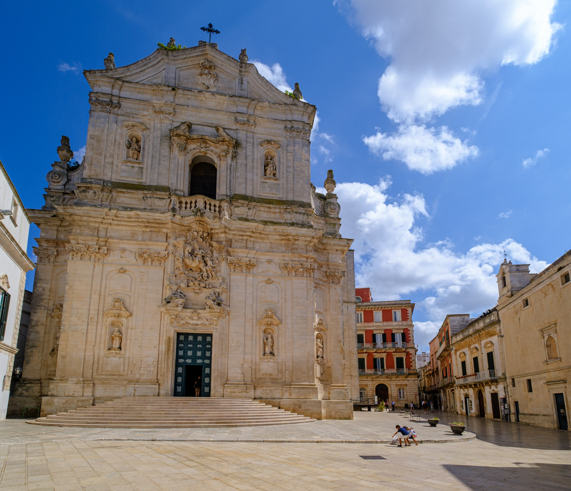 Kids playing in front of the church in Martina Franca Puglia