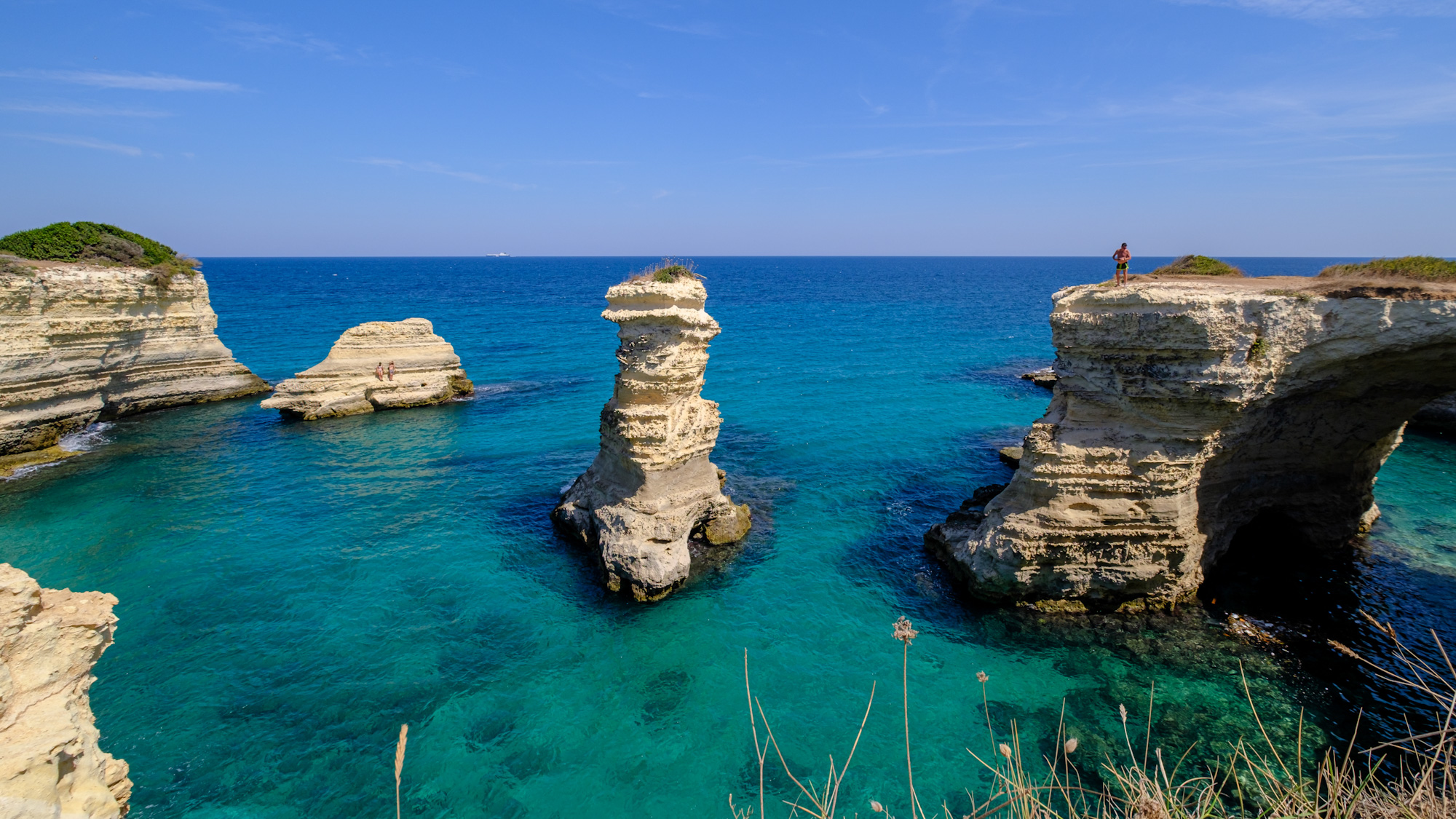 The magnificent coast of Puglia with the Faraglioni de Sant Andrea