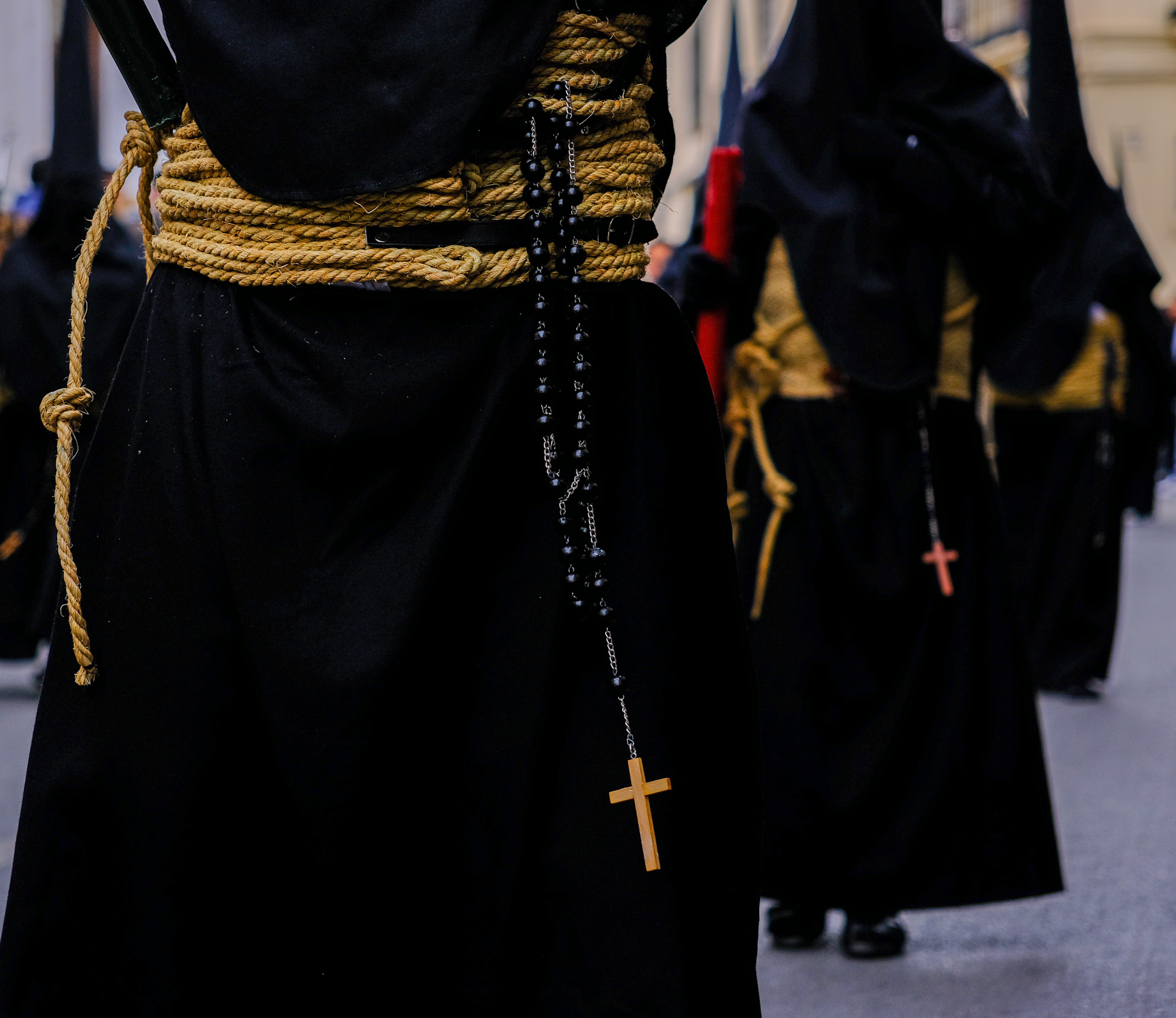 Details of row of penitents in Ronda Andalusia during Semana Santa processions