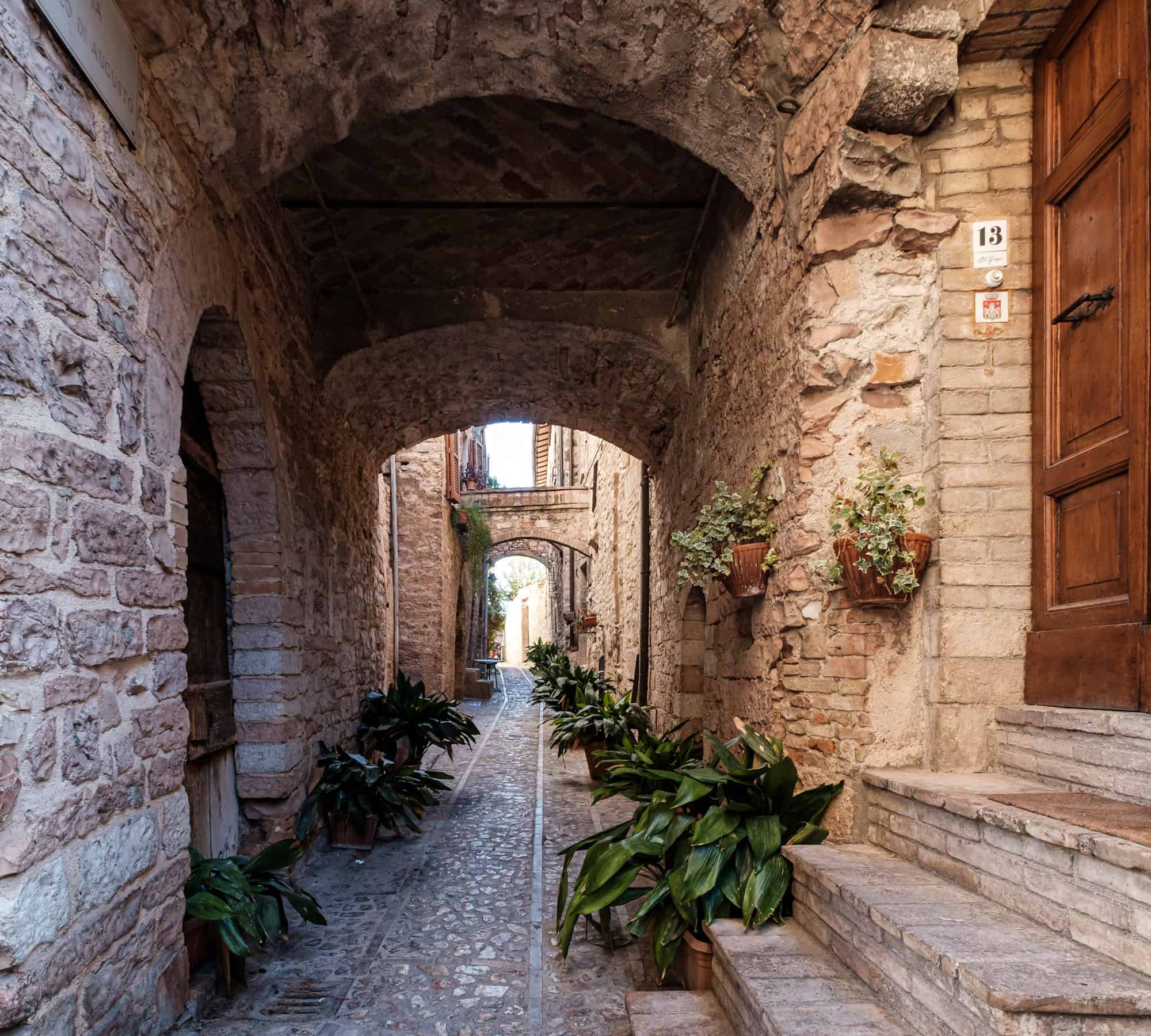 Stone streets, arches and flowers in Spello Umbria
