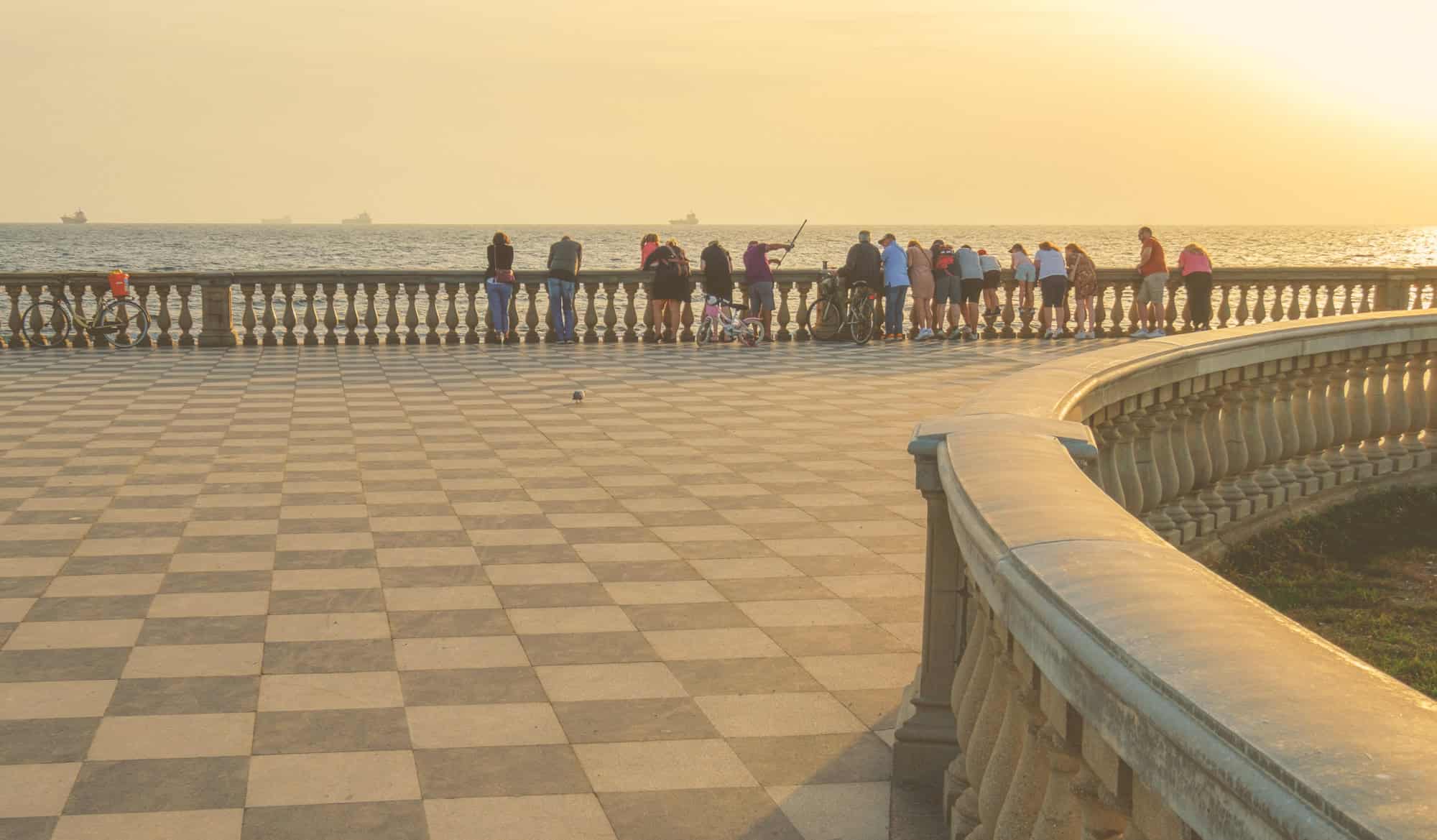 People on the promenade in Livorno Tuscany