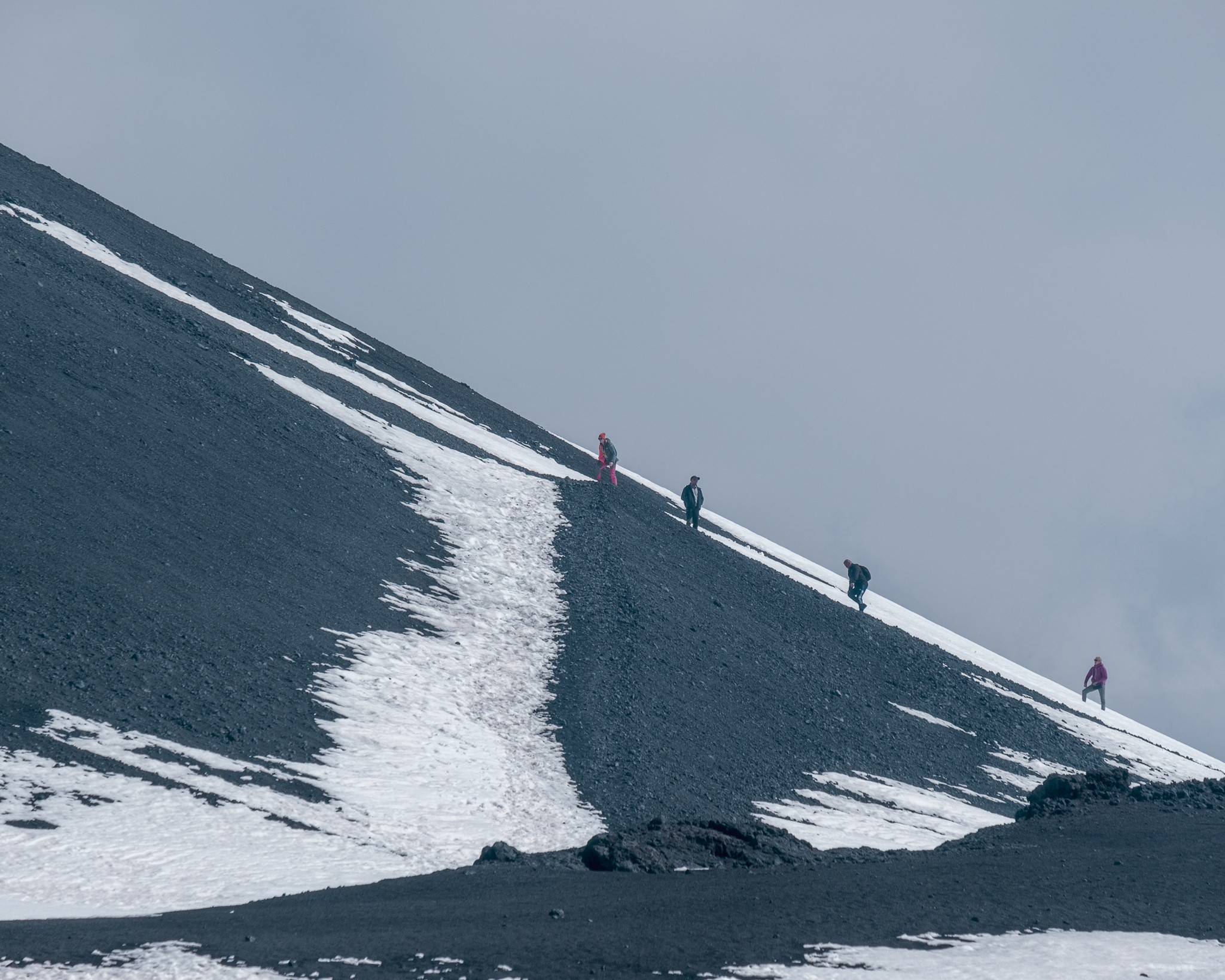 Cloudy day and people walking on Mount Etna Sicily