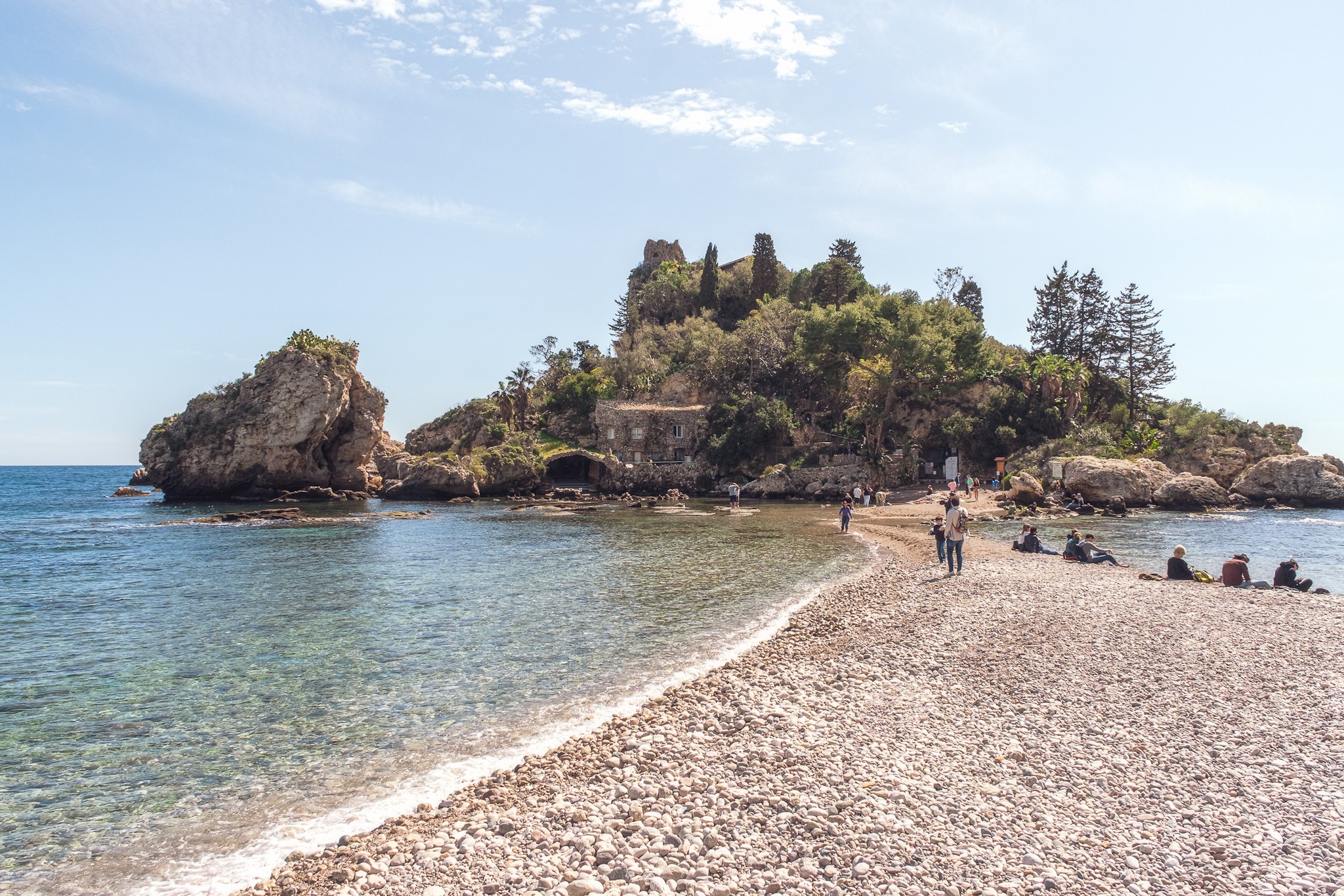 People enjoying a beautiful day in Isola Bella Taormina Sicily