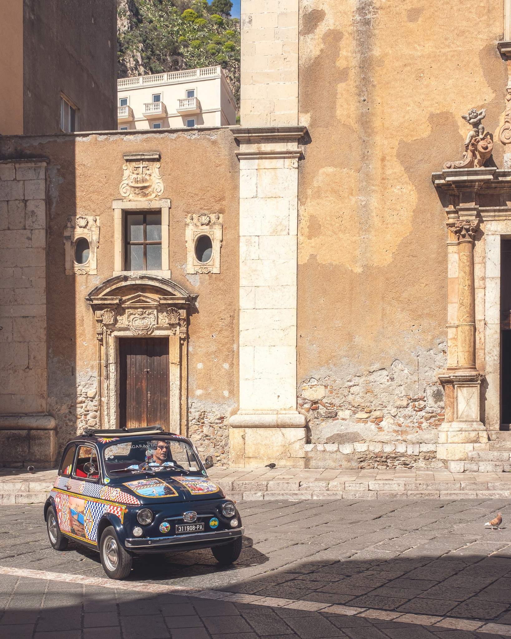 Small old car in the streets of Taormina Sicily