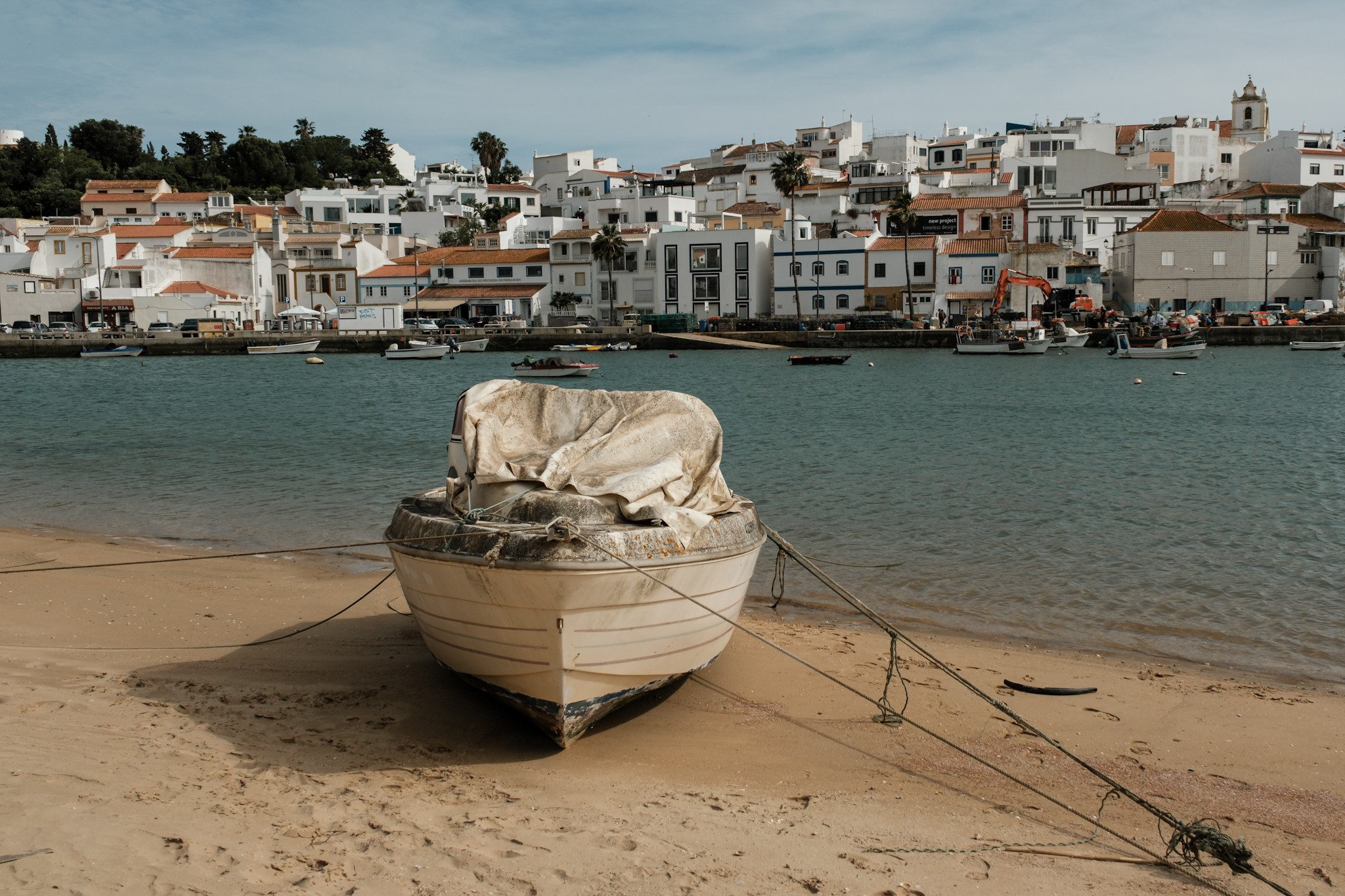 Abandoned boat on the beach in Ferragudo Algarve