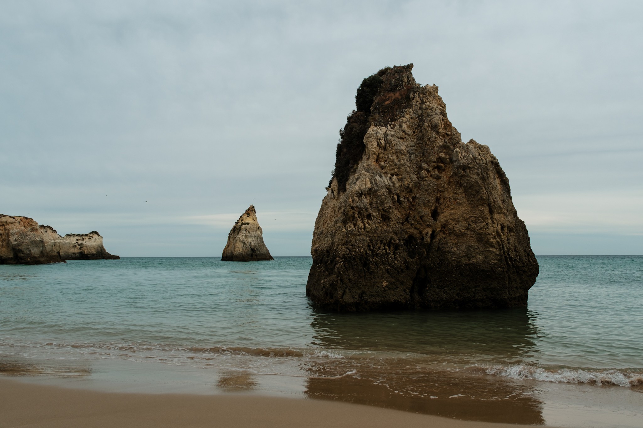 Silence, rocks and the ocean at Praia dos Tres Irmaos Algarve